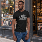 Man wearing the black Wrap Records t-shirt outside a record store